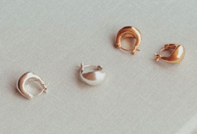 ASAMIFUJIKAWA(アサミフジカワ)の【SPURSHOP別注】ゴールド